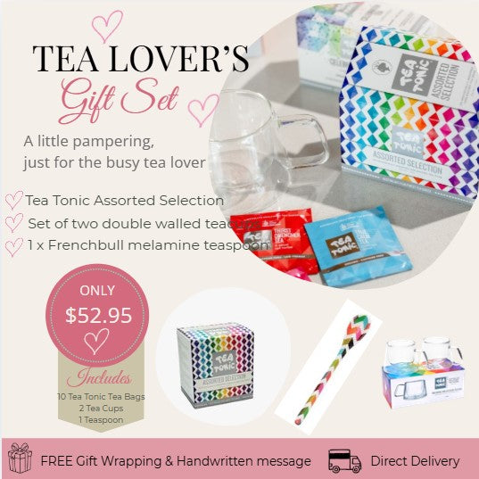 Tea Lover's Gift Set with tea bags, cups, and a spoon on a white background