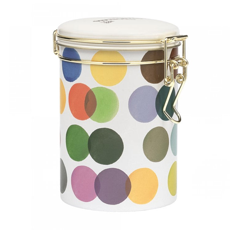 A white tin canister with a colorful polka dot pattern and a gold-tone metal clasp lid, shown on a plain white background.