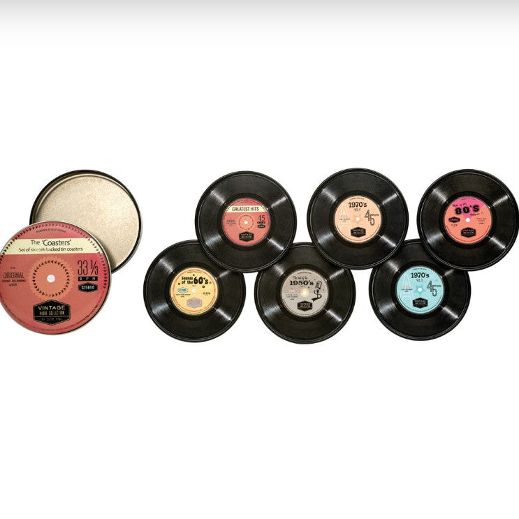 A set of six novelty CD-shaped items displayed on a white background, including five black vinyl records with different colored labels and storage tin