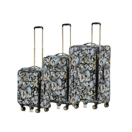 Set of three floral-patterned suitcases on a white background