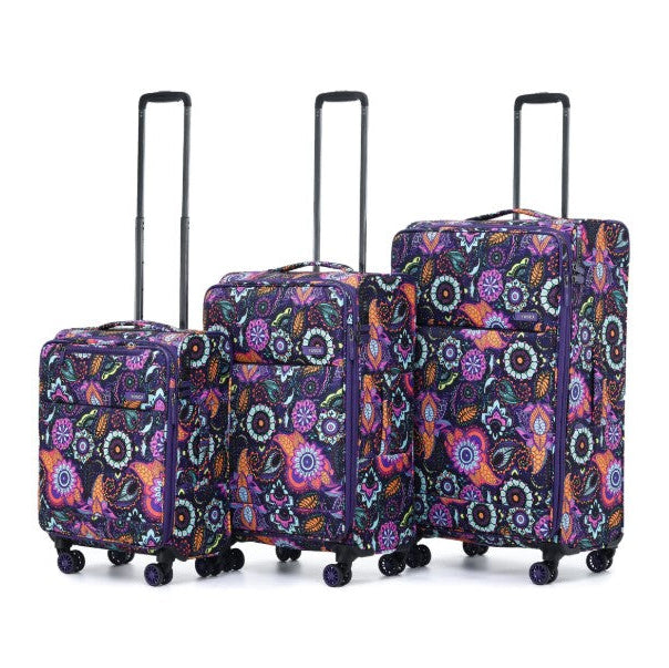 Set of three patterned suitcases on a white background
