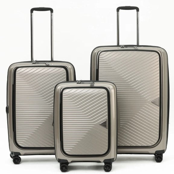 Set of three silver suitcases with a geometric pattern on a white background