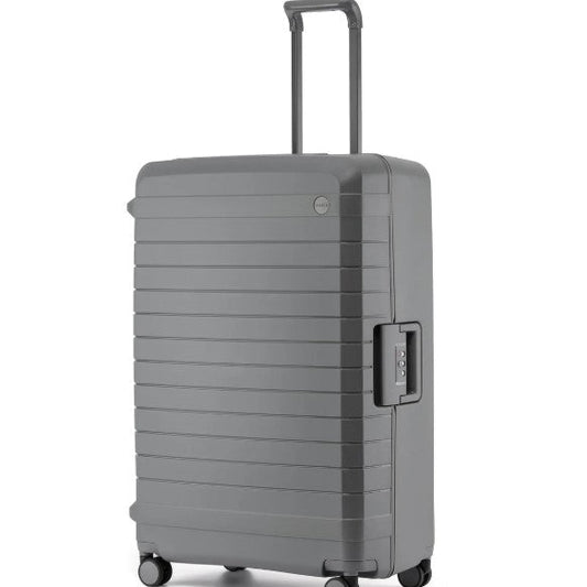 Gray suitcase with a textured surface on a white background