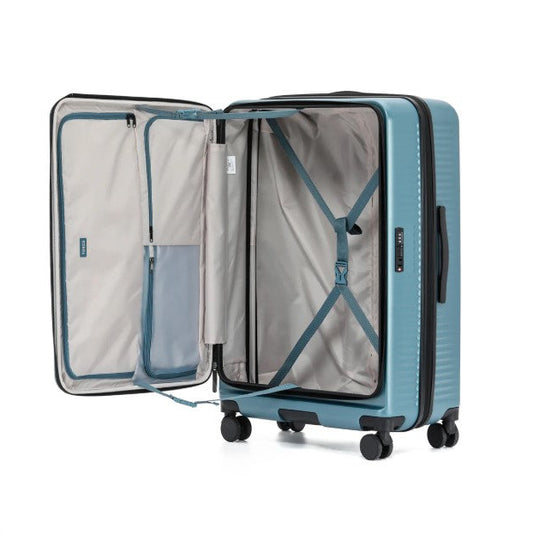 Blue suitcase with open door on a white background