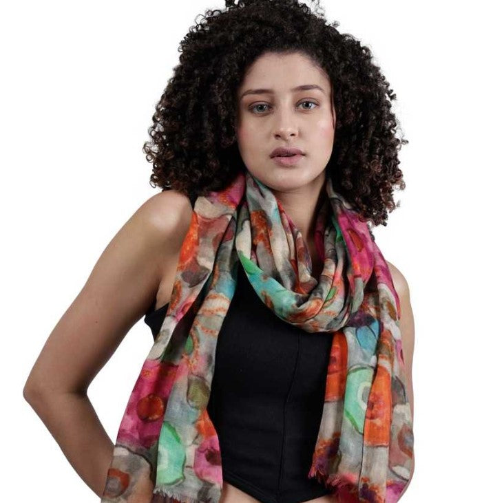 Woman wearing a colorful scarf on a white background