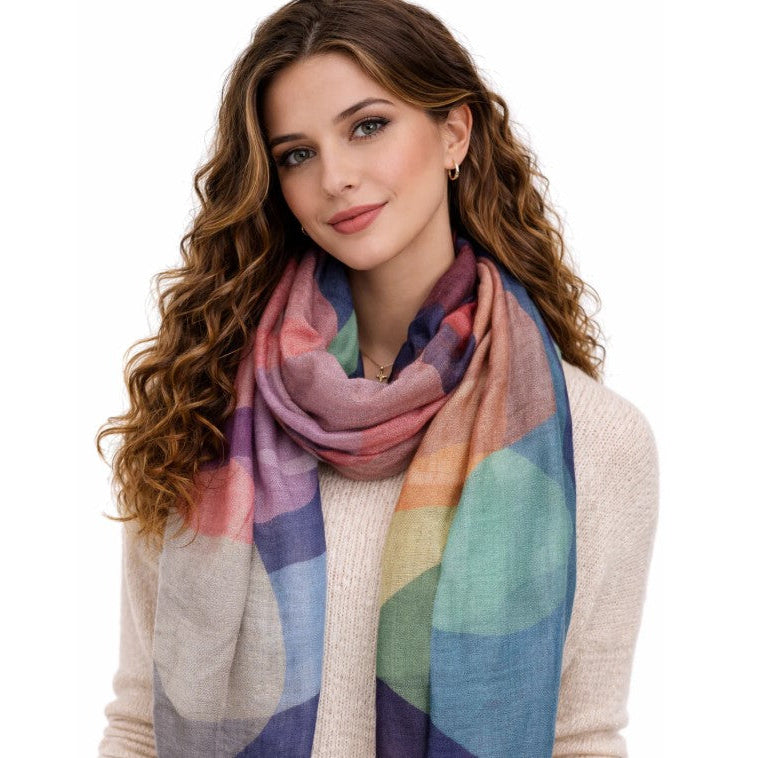 Woman wearing a colorful scarf on a white background
